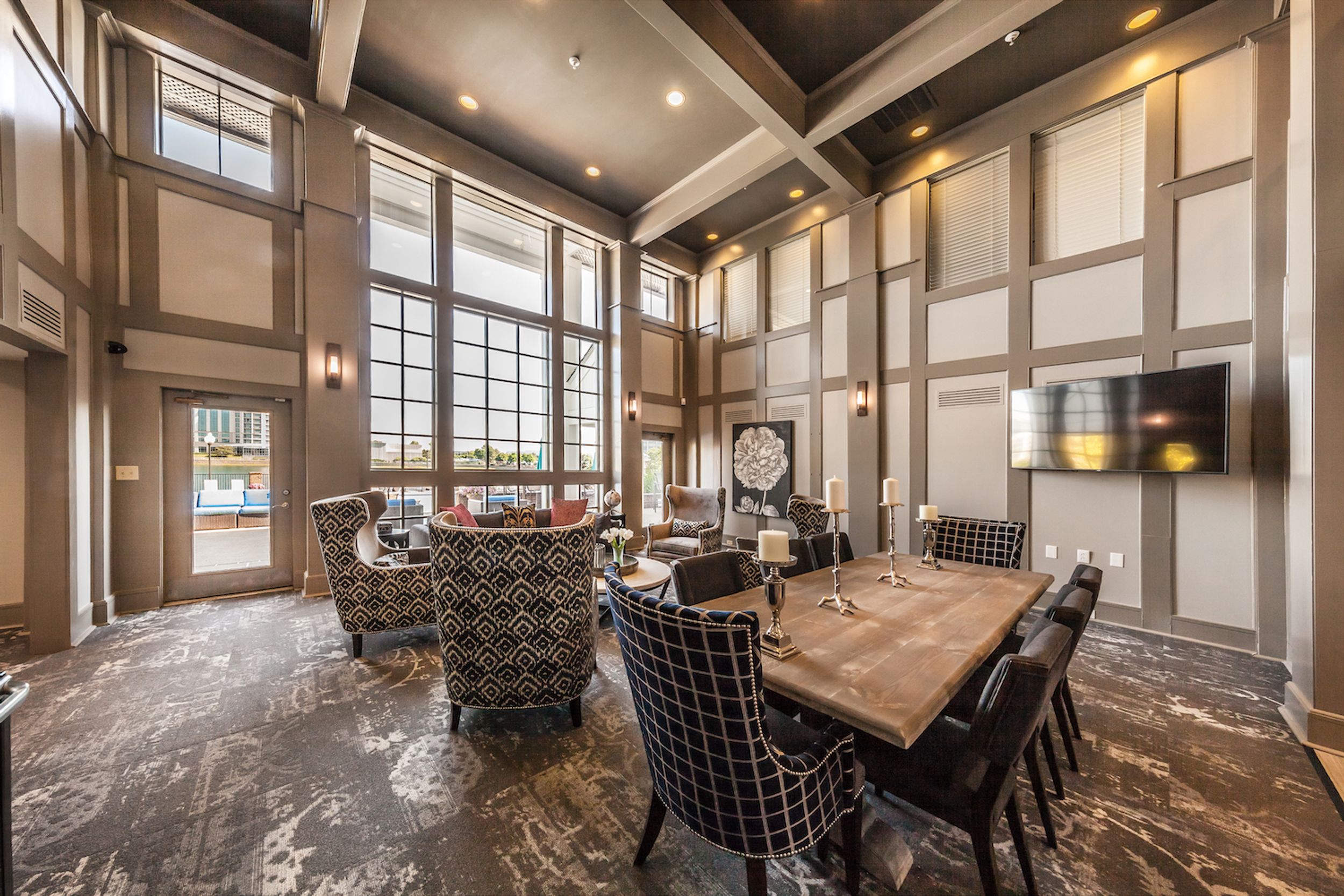 dining room and kitchen with view of apartment entrance
