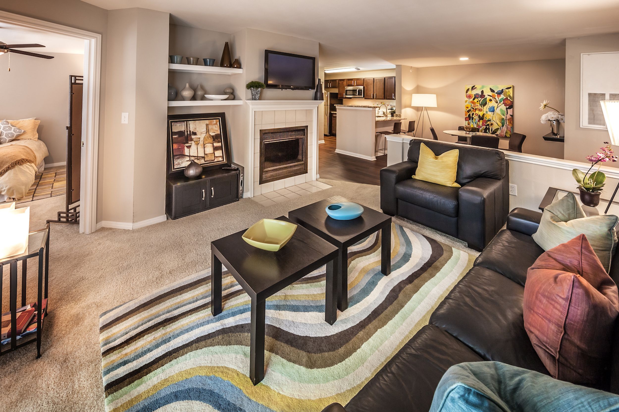 Big open floor plan of living room, dining room, kitchen, and bedroom