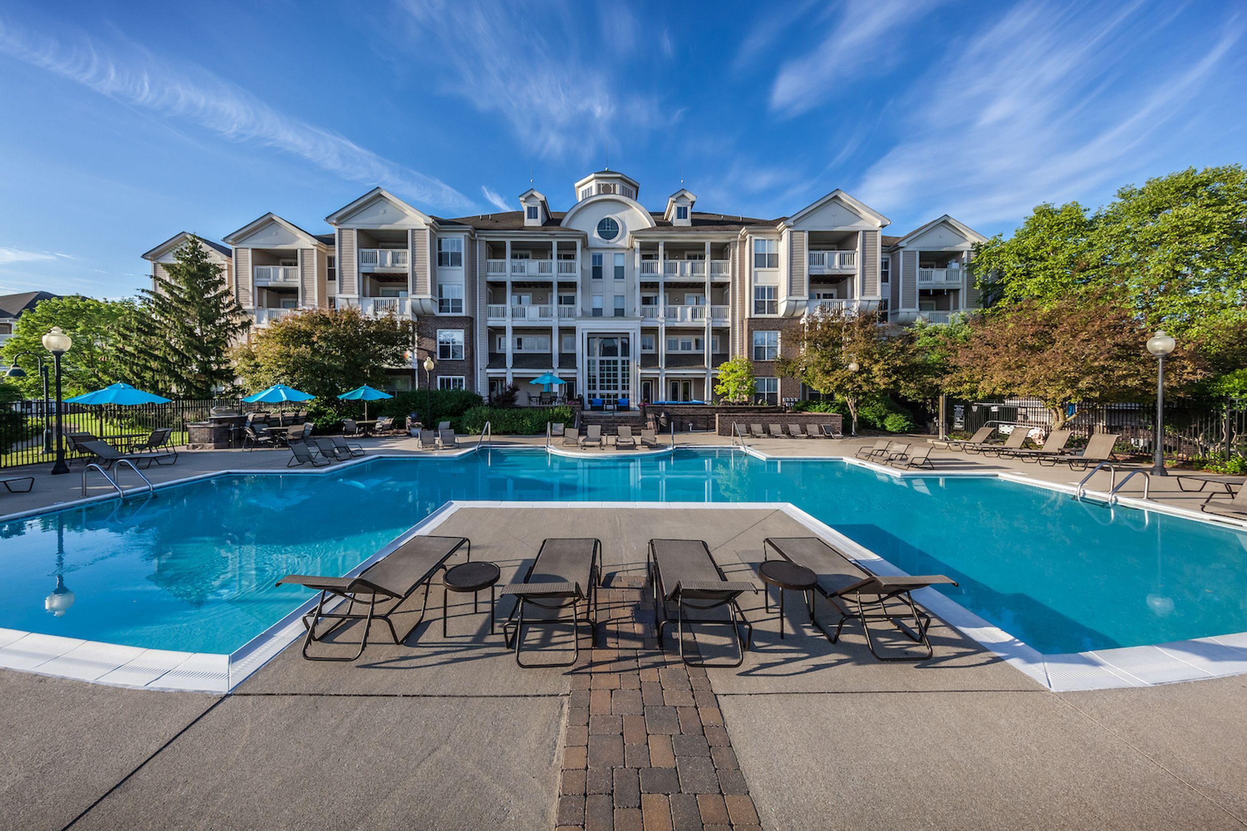 Straight on view of building exterior and pool