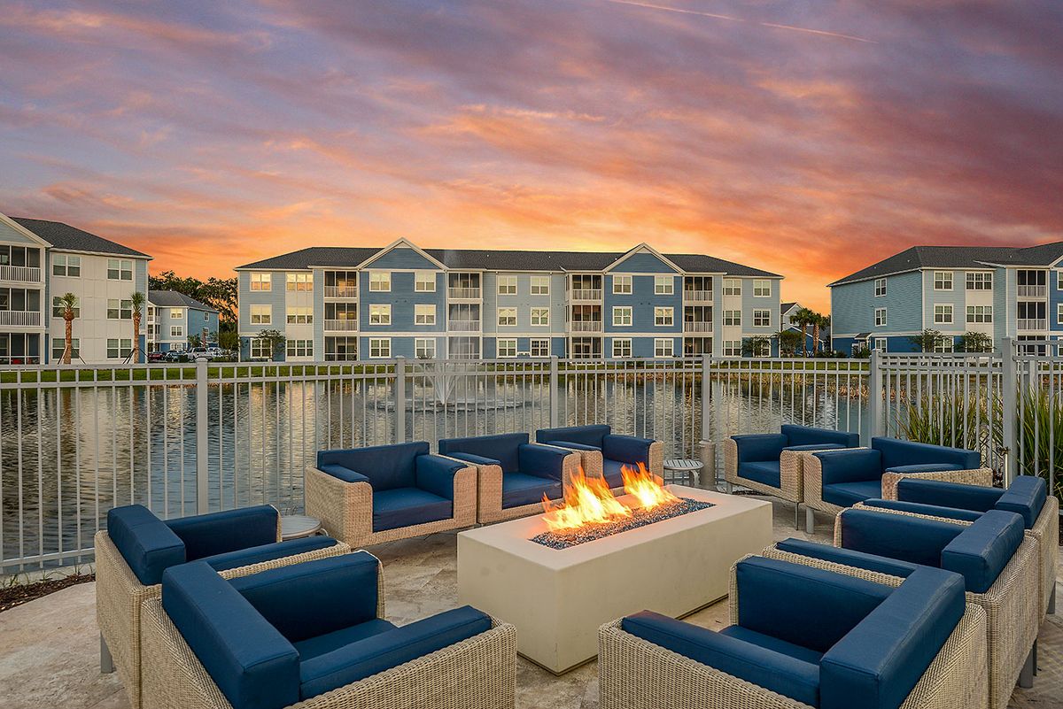 fire pit with chairs around it