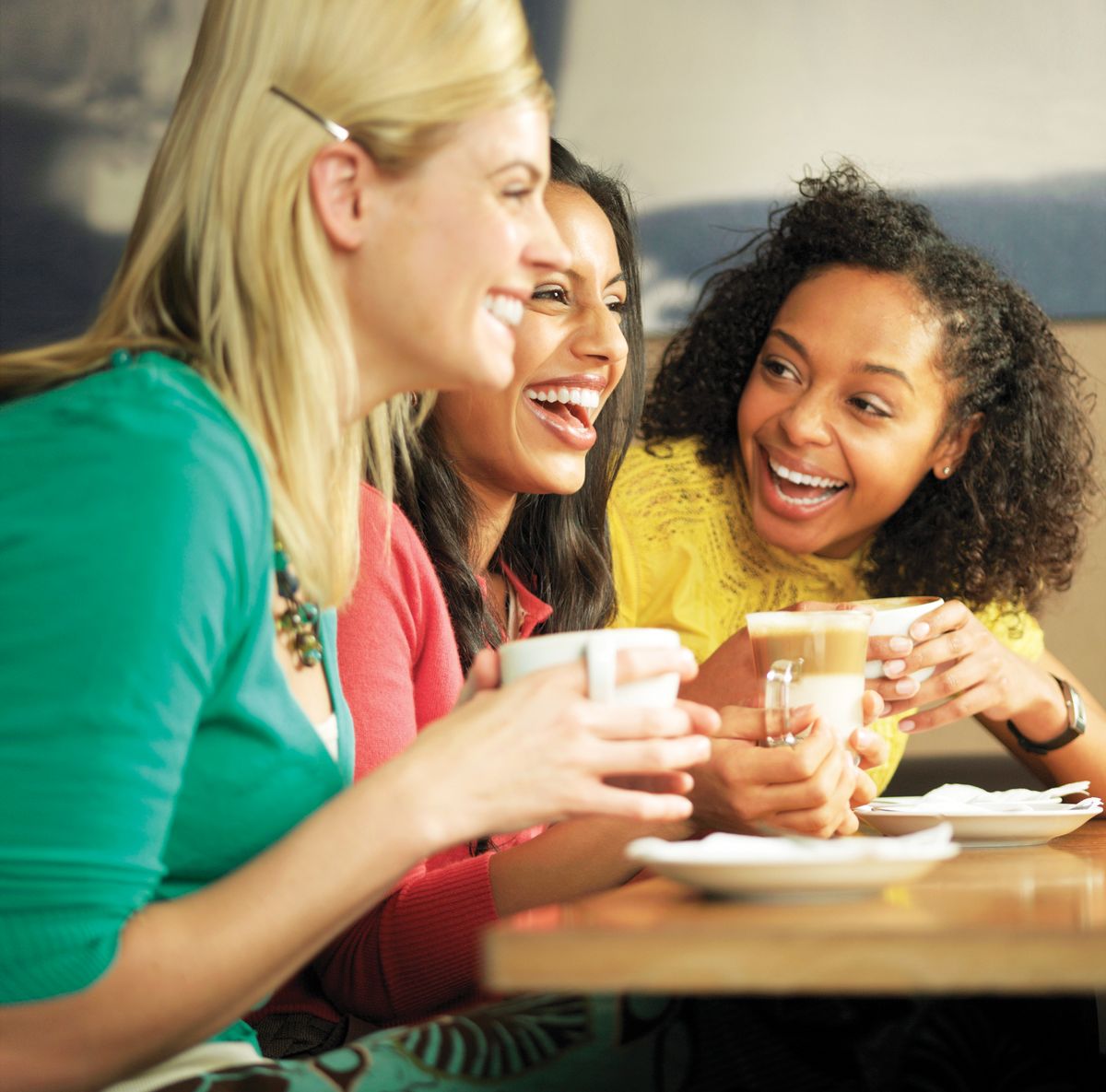 Ladies enjoying coffee and smiling