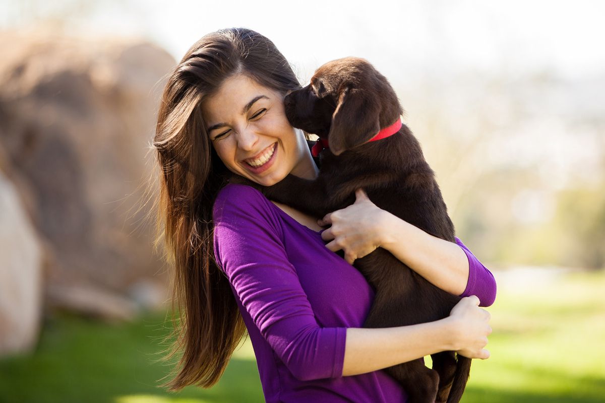 lady with puppy in arms