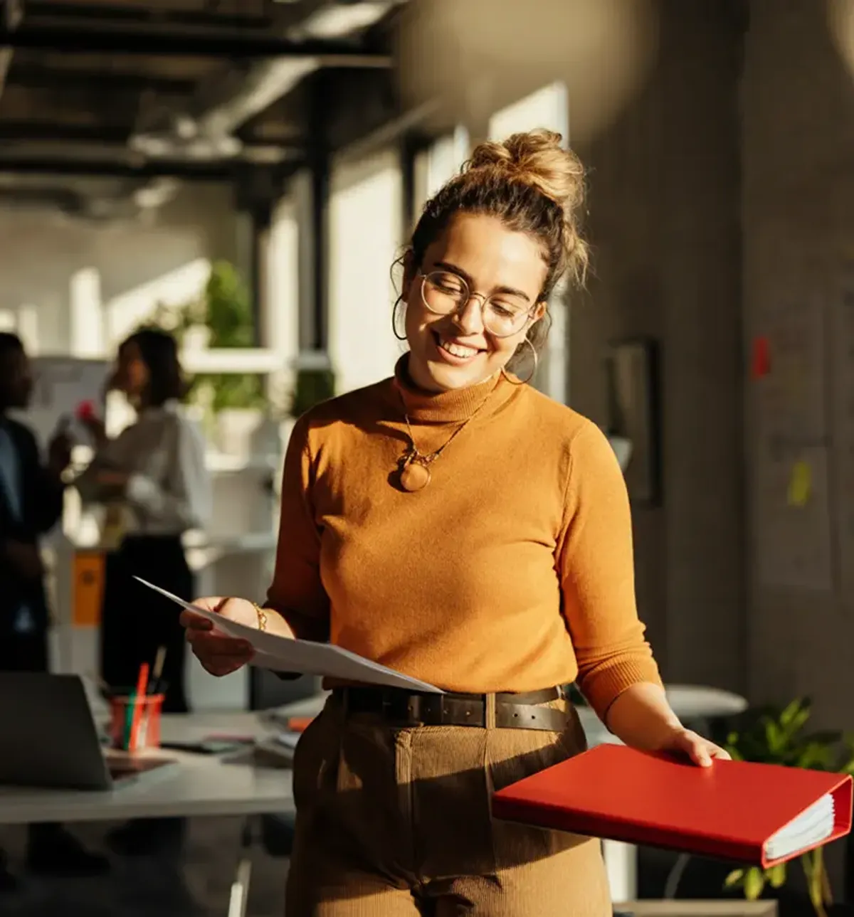 Professional woman in office setting smiling