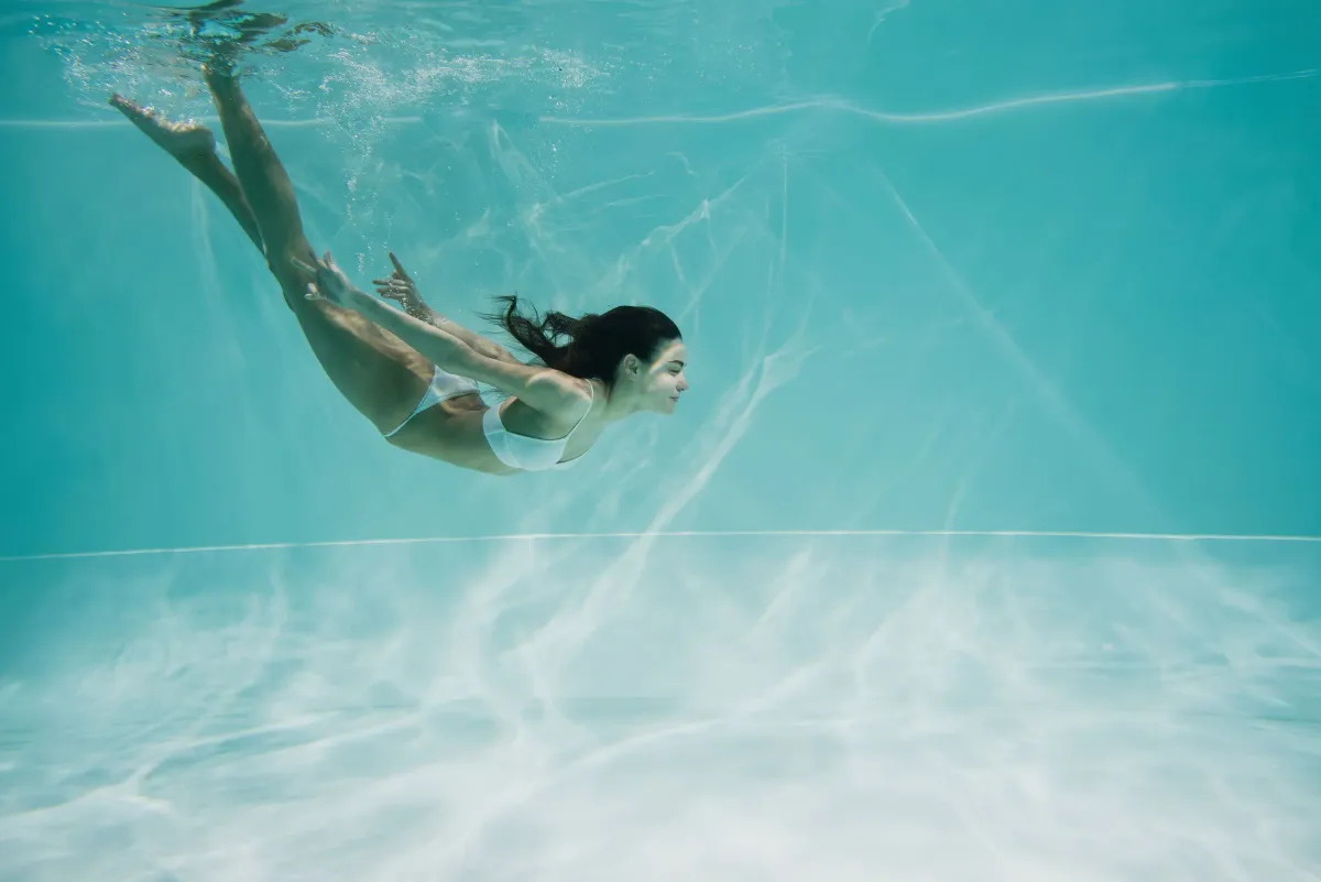 Women Swimming in pool